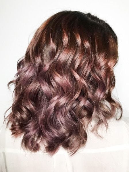[ad_1]

Chocolate mauve is the new hair trend that allows you to go rose gold without dyeing your dark hair blonde. It uses the brown hues in your already dark hair mixed with iridescent pink tones to create a natural, balayage…